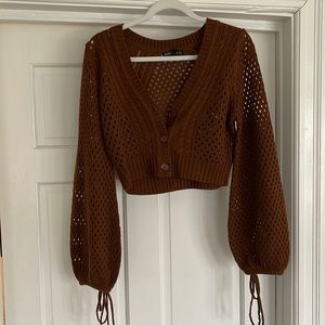 Crop Top, cozy, brown sweater with holes. Bralette would look perfect with it.